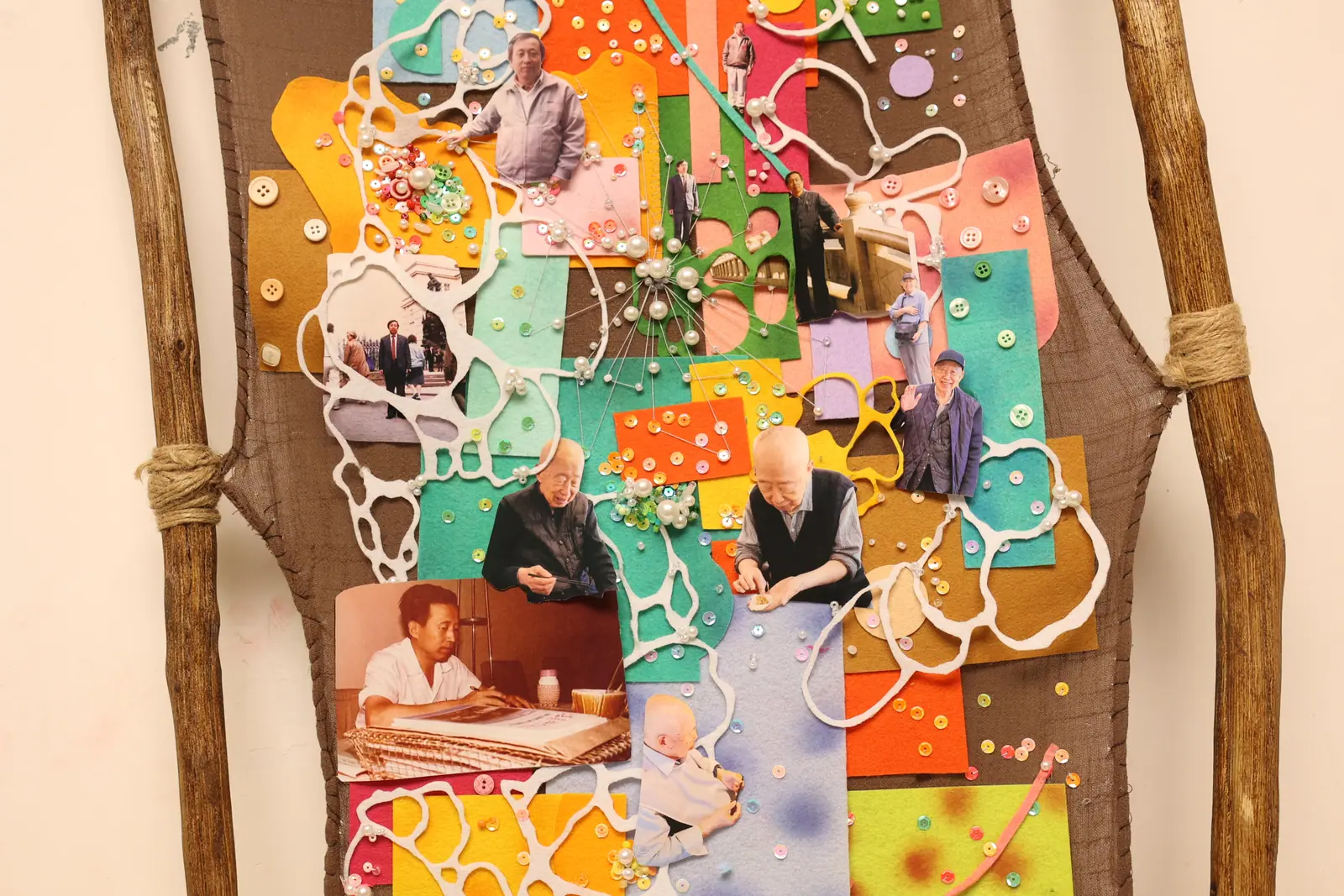 Collage of family photographs inside a carved wooden frame