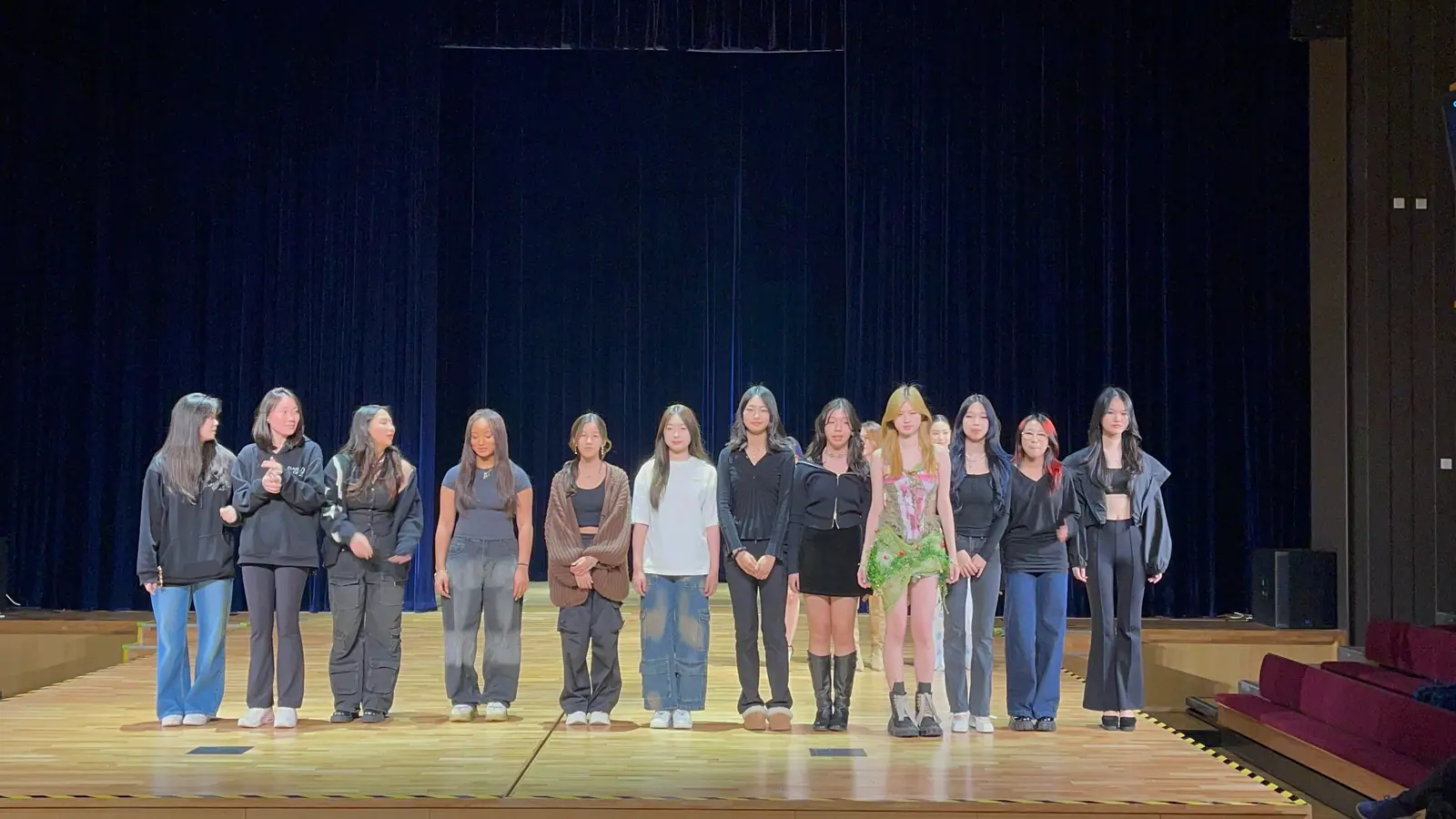 Finale line-up of models and crew on stage